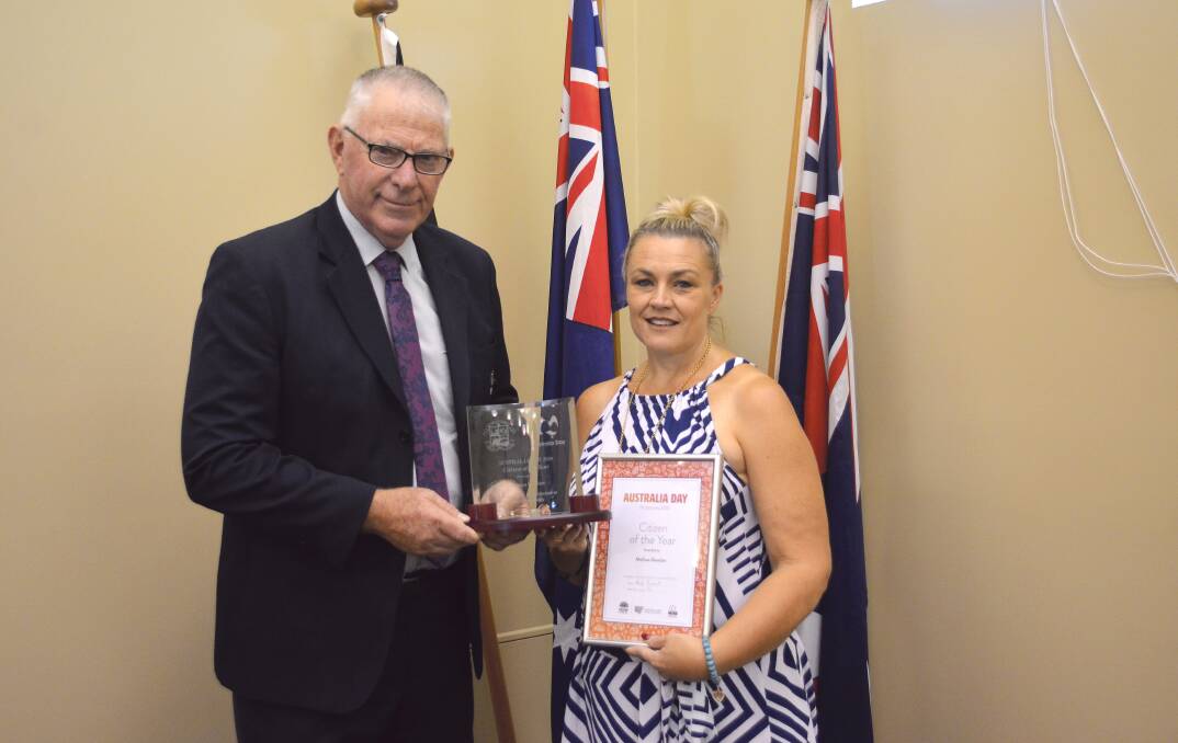HONOUR: Cessnock mayor Bob Pynsent presents Melissa Gontier with the citizen of the year award on Tuesday.