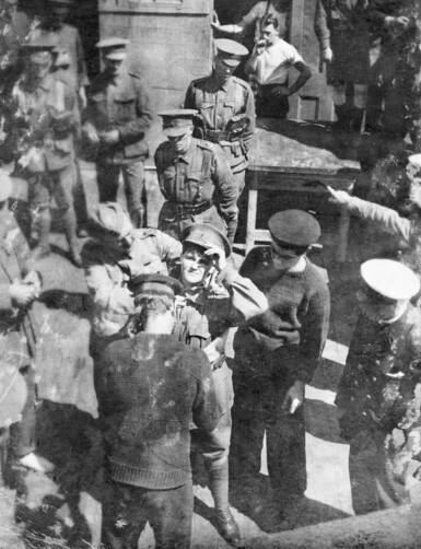 A life belt is being placed around Maud's waist before she is transferred at sea from HMAT Suevic to the Achilles 24 December 1915. Picture: Australian War Memorial