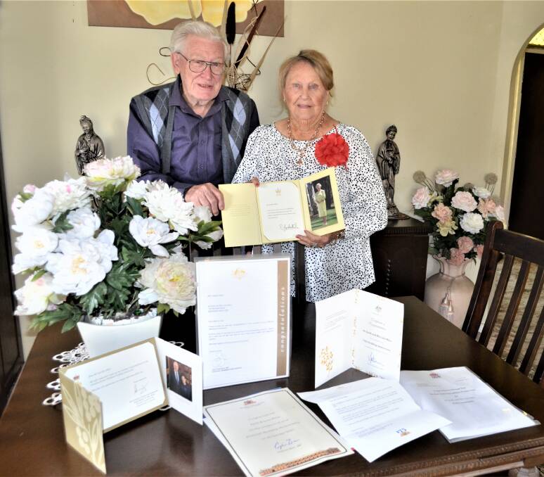 CONGRATULATIONS: Keith and Lola Miles, of Aberdare, with some of the cards they have received for their 70th wedding anniversary. Picture: Krystal Sellars