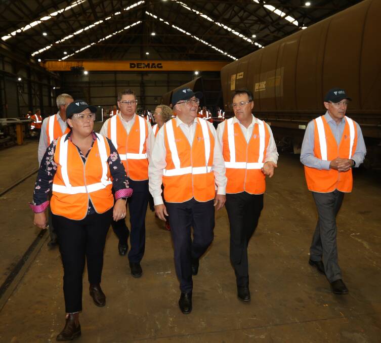 LOCAL PITCH: Paterson MP Meryl Swanson and opposition leader Anthony Albanese on a tour of Varley's Carrington workshop last Thursday. Picture: Jonathan Carroll