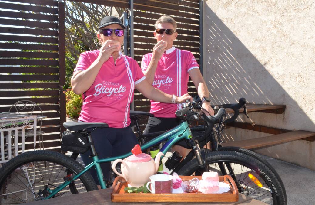 GOOD CAUSE: Lorraine and Darryl Parker, of Cessnock, enjoy some pink scones at Grice's Bakery before heading out on a ride on Friday. Grice's, along with Millfield General Store, will donate 50 cents per pink scone sold in October to the National Breast Cancer Foundation.
