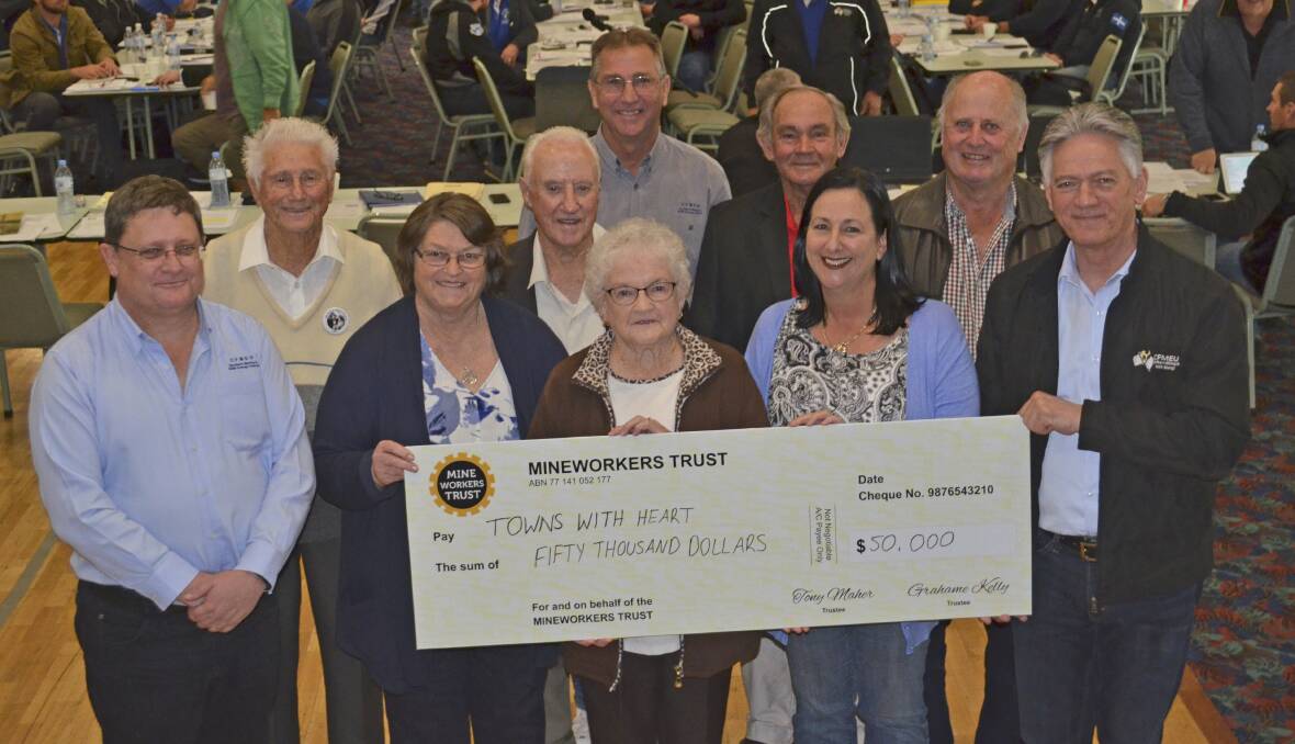 MILESTONE: CFMEU representatives present the Pit Horse Statue Project committee with a donation for $50,000 at the union meeting at East Cessnock Bowling Club on Friday.