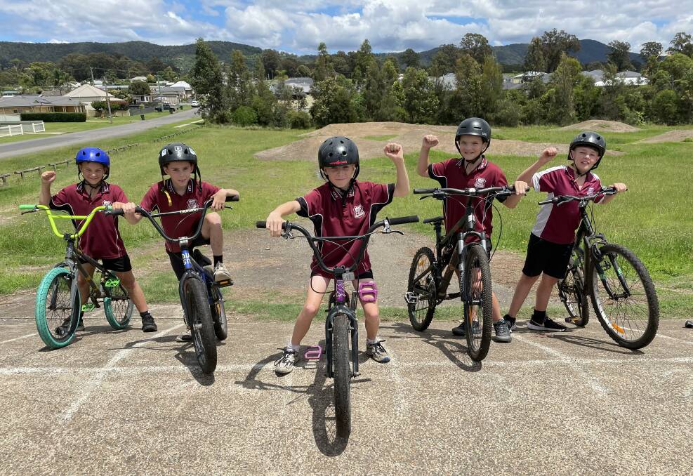 PUMPED: Bellbird Public School students Charlee, Jack, Tynan, Zavier and Chase celebrate the news that the Carmichael Park BMX track will be upgraded. Picture: Krystal Sellars