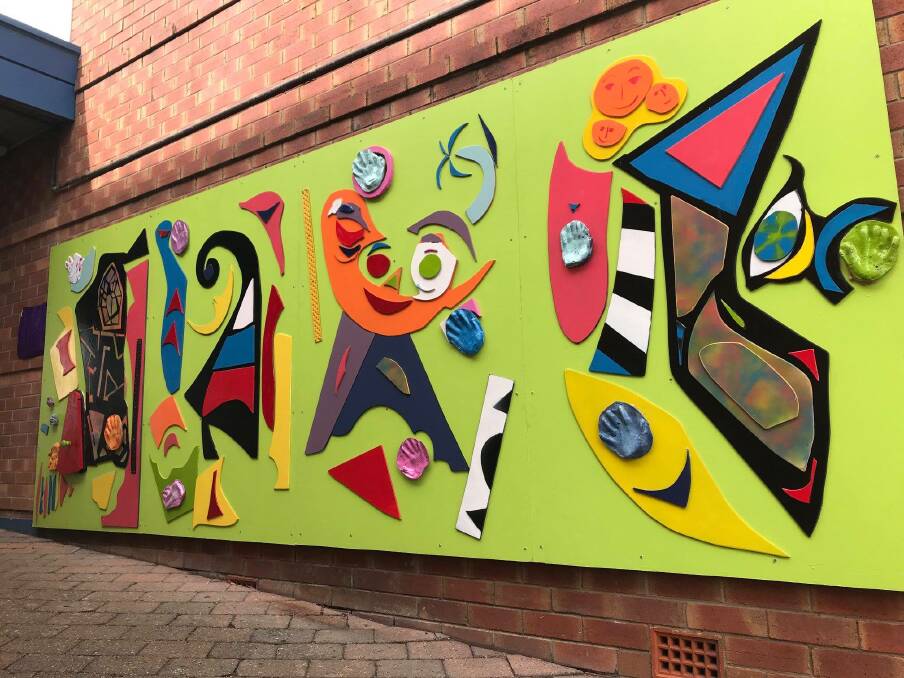 COLOURFUL: People with disability were among the community members who created the Inclusion Mural on the Vinnies building in Kurri Kurri. Picture: Ability Links NSW