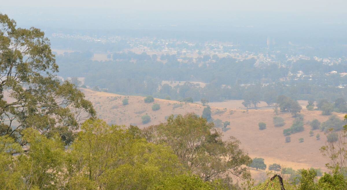 HAZE: Smoke lingers over Cessnock, as seen from Bimbadeen Lookout, on Tuesday afternoon.