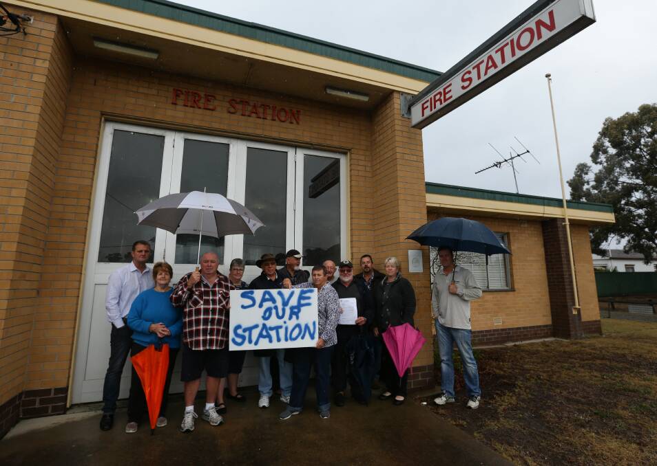 THE FIGHT IS ON, AGAIN: Cessnock MP Clayton Barr, councillor Anne Sander and community members at Weston Fire Station, which may close soon. Picture: Jonathan Carroll