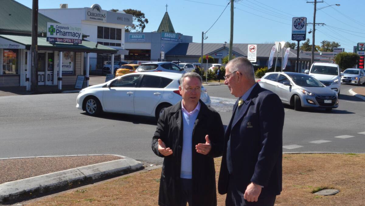 PINCH POINT: Hunter MP Joel Fitzgibbon and Cessnock mayor Bob Pynsent discuss traffic at the intersection of Darwin Street and Wollombi Road.