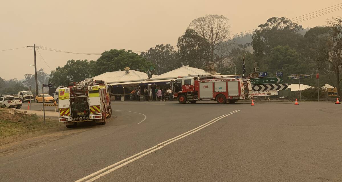 STAGING AREA: Fire trucks outside Wollombi Tavern on Friday.