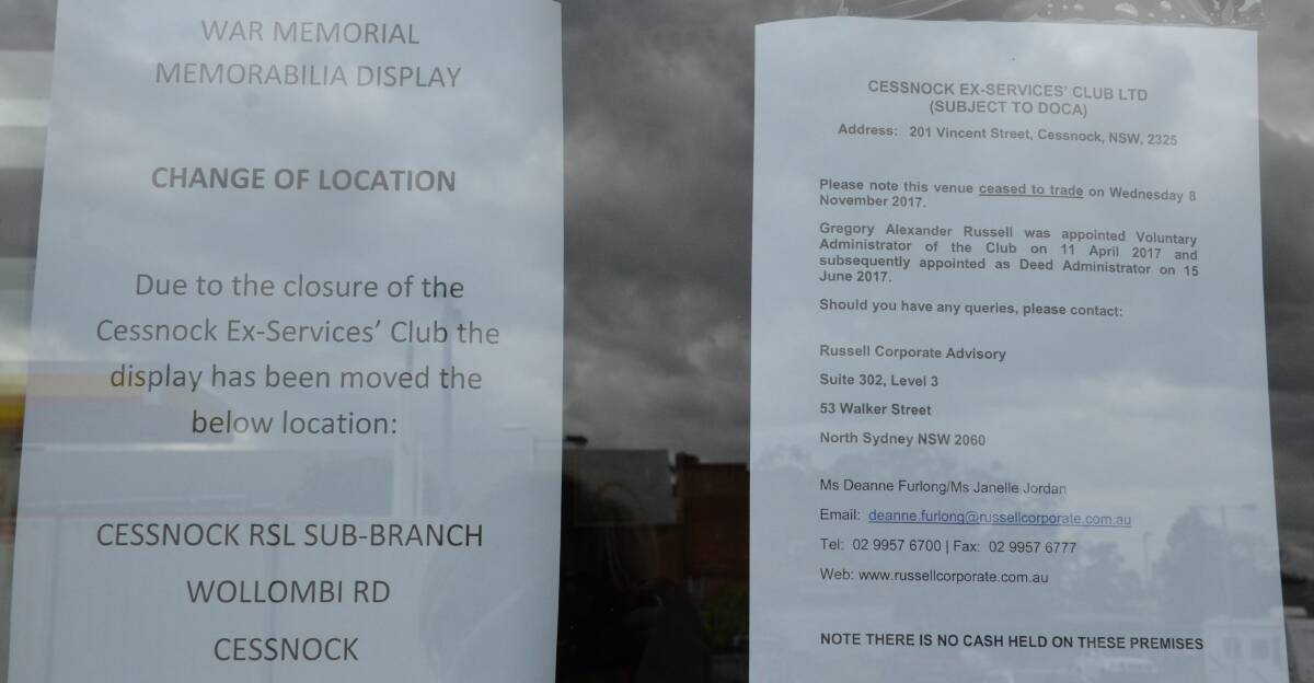 The signs that were placed in the club window on Wednesday.