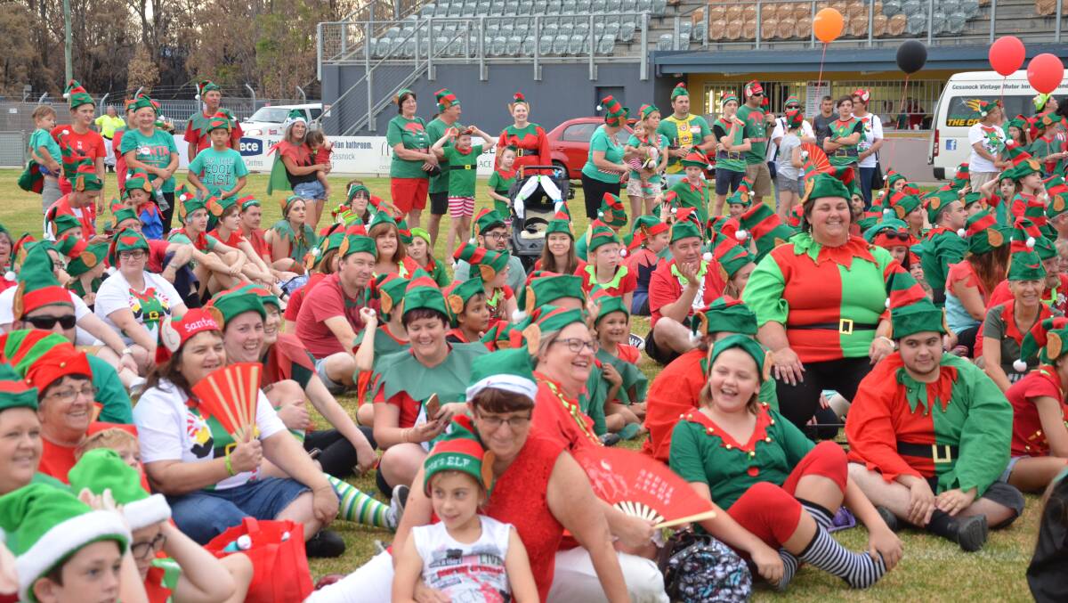 SEA OF RED AND GREEN: Almost 400 people dressed up as elves for the Great Cessnock Christmas Elf Challenge at Carols in the Park on December 2. Picture: Krystal Sellars