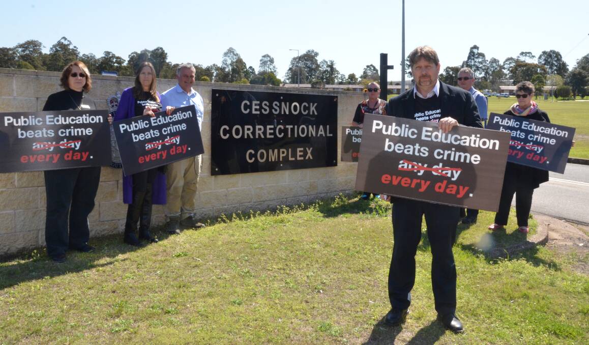 DISAPPOINTED: NSW Teachers Federation representative Michael Falcioni (front) and Cessnock Correctional Centre teaching staff at a stop-work meeting on September 5.