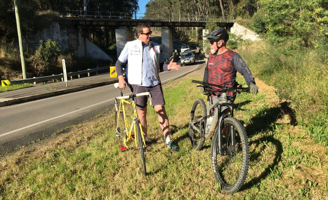 VISION: Cessnock Bicycle Company owner Steve Whitby and local cyclist Glen Irwin near The Pinch on Wollombi Road, Pelton. Picture: Krystal Sellars