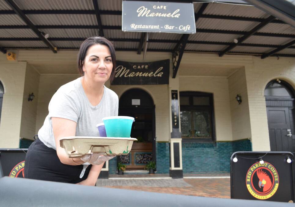 DRIVE-THROUGH COCKTAILS: Cafe Manuela owner Meryem Sarnelli with some cocktails that can be ordered online and delivered to your car.