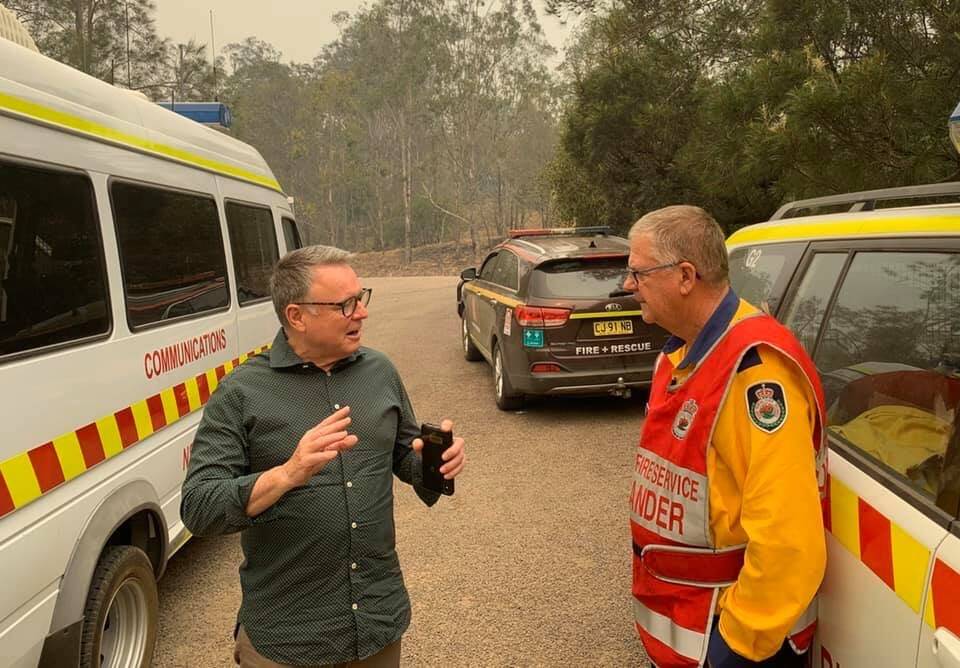 ON THE GROUND: Joel Fitzgibbon chats to RFS Lower Hunter group captain Neale Mutton at Wollombi on Friday.