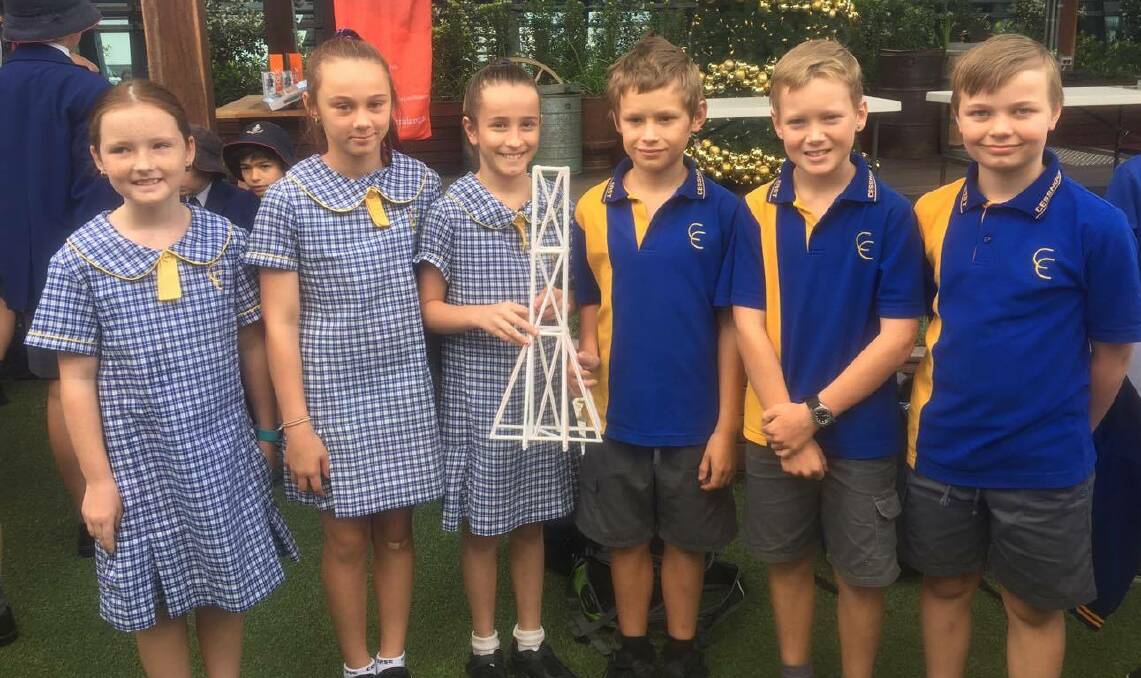 INNOVATION: The Cessnock East Public School team Sophie, Kayla, Bianca, Seth, Daniel and Callum with their winning tower at the Engineers Australia Straw Tower Challenge.