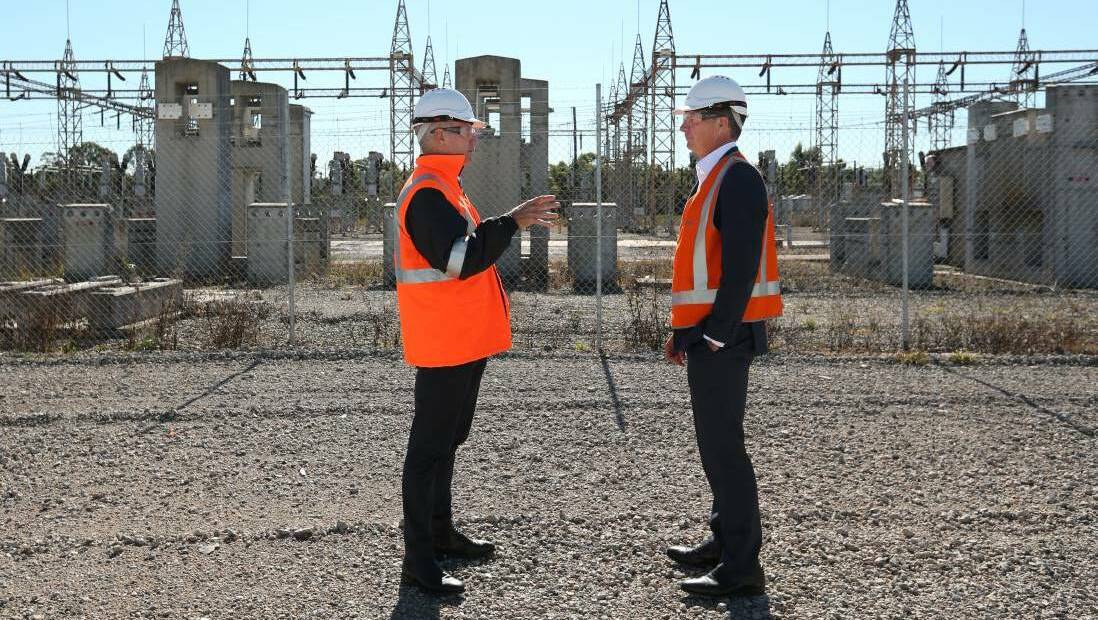 Snowy Hydro chief executive and managing director Paul Broad at the former Kurri Kurri smelter site proposed for a gas-fired power station, with Energy Minister Angus Taylor in May this year.