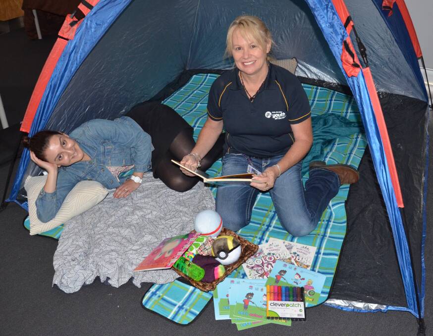 QUIET SPACE: Renee Cayas, from Ability Links, and Vicki Eastwell, from Youth off the Streets, with some of the items that will be in the chill-out zone at the Cessnock Harmony Day Festival. Picture: Krystal Sellars
