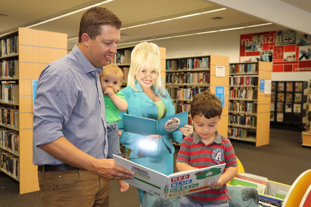 JOY OF READING: Cessnock mayor Jay Suvaal with his children Ethan and Caleb at Cessnock Library.