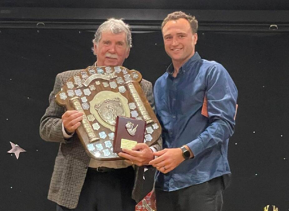PRESENTATION: Life member Ross Smith presents the R.E. Smith first grade major premiers to Greta/Branxton captain Joey Butler. Greta/Branxton and Bellbird were joint major premiers after the grand final was washed out.