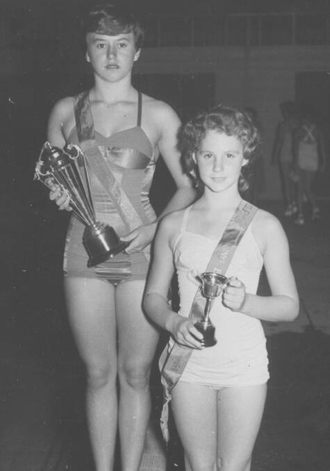 SURPRISED: Champion swimmer Janice Fogg (left) 'accidentally' won the Miss Cessnock 1953 pageant at Cessnock Pool.