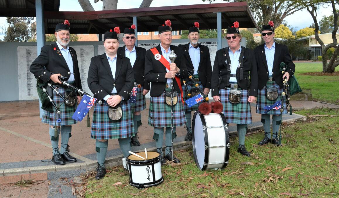 HONOUR: Cessnock District Pipes and Drums Band members John Edwards, Garth Thompson, Len Stoker, Ron Watkins, Michael Steele, Paul Wilson and Malcolm McLennan performed at the war memorial on Saturday for the 75th anniversary of the Victory in the Pacific. Picture: Krystal Sellars