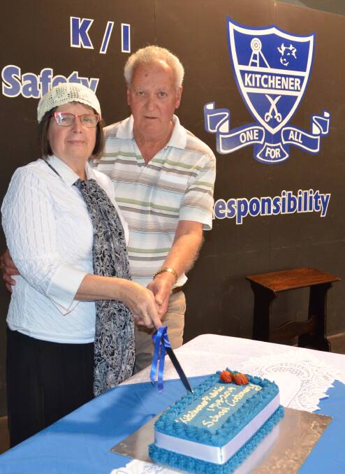 SPECIAL DAY: Kitchener Public School administration manager Sue Richard, in 1919-inspired clothing, and former student Lindsay Teasdale cut the centenary cake. Picture: Krystal Sellars