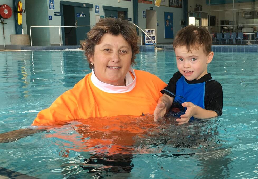 VITAL SKILLS: Kurri Kurri Aquatic Centre teacher Kate Weldon (pictured with Russell, 5) has been nominated for the Austswim NSW Awards for Excellence. Picture: Kate Grigor