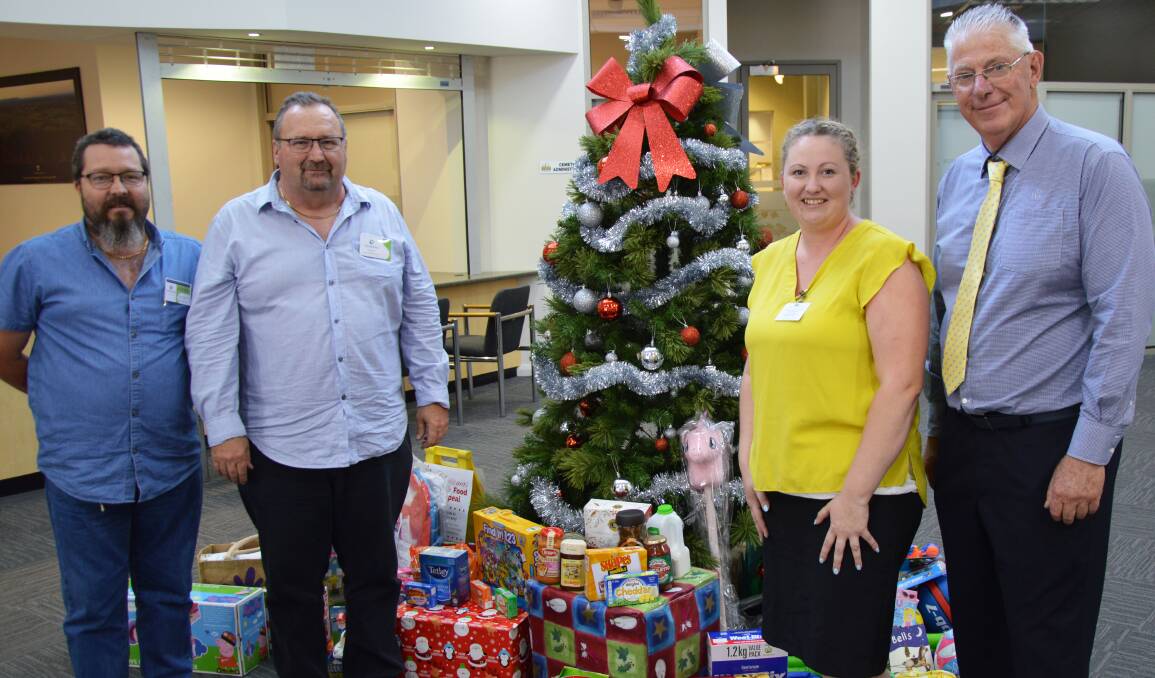 GENEROUS: Peter Woolven and Greg Stevens from the Samaritans and Cassie Russell from Kurri Kurri Community Centre with Cessnock mayor Bob Pynsent at the donation handover.