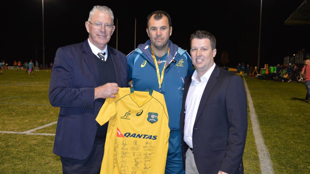 IMPRESSED: Cessnock mayor Bob Pynsent, Wallabies coach Michael Cheika and Cessnock councillor Jay Suvaal at Cessnock Sportsground, where the Wallabies held a training camp this week.