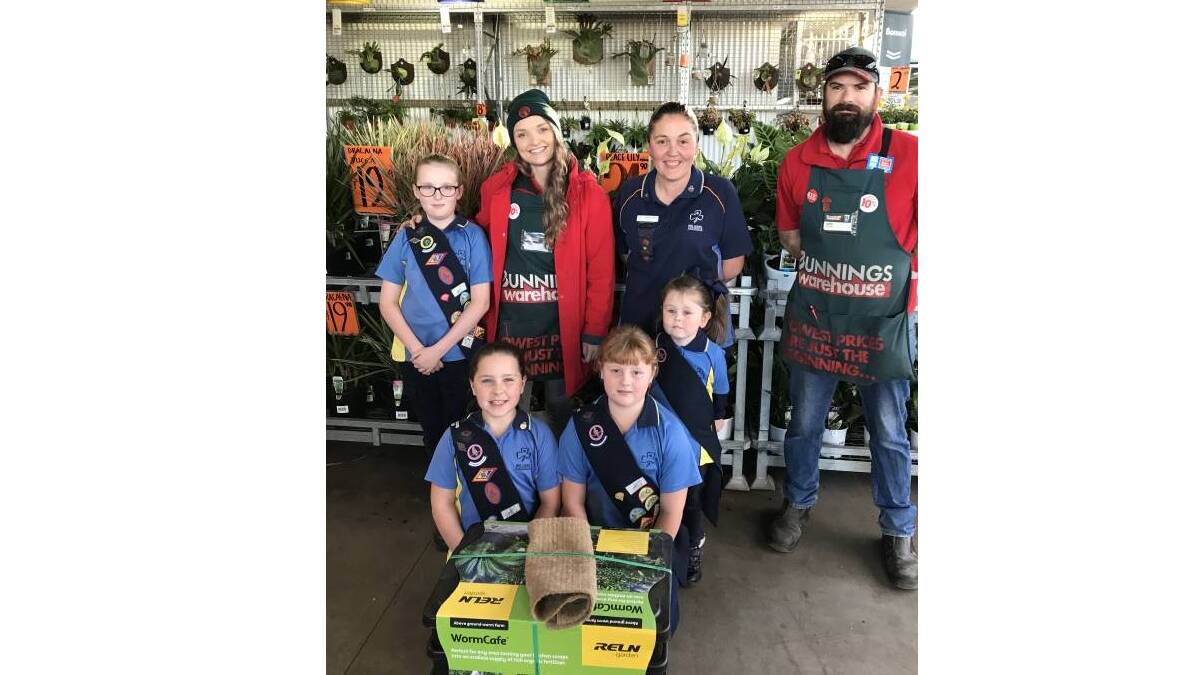 HAPPY: Bunnings Cessnock staff Tyler and Luke presented Cessnock Guides representatives Phoebe, Kelly, Sophie, Ella and Lexi with their new worm farm. 