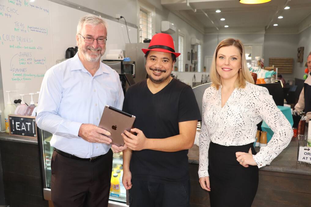 PROUD TO BE LOCAL: Cessnock City Council economic development team member Brad Sangster, Darwin from Darwins Cafe on Vincent, and councils acting economic development manager Rhiannon Stevens.