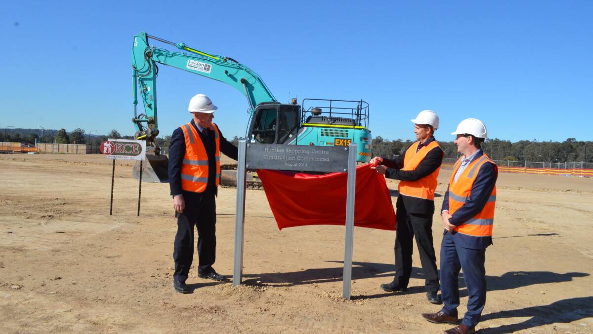 EXCITING: Cessnock mayor Bob Pynsent, Coles state development manager Howard Hathorn and Huntlee project director Stephen Thompson at the construction site.