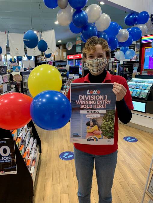EXCITED: Cessnock Plaza News & Gifts staff member Lucy Long celebrates the news that the newsagency sold a division one winning ticket.
