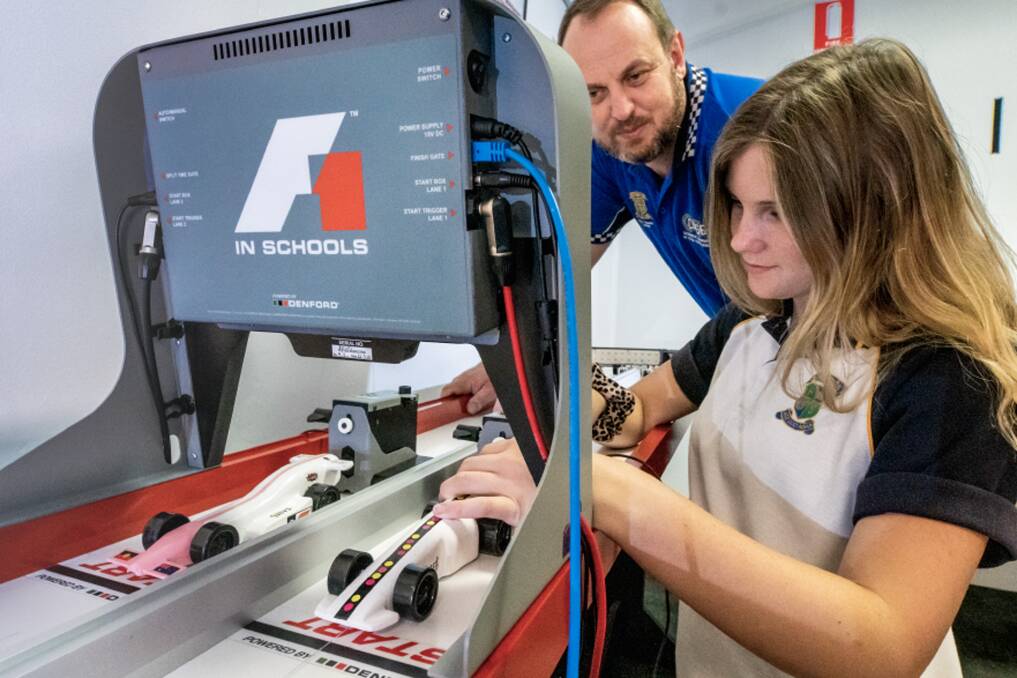 ENGAGING: Dr Sleap pictured with Cessnock High student Jordarna Barber, working on their entry for the F1 in Schools challenge.