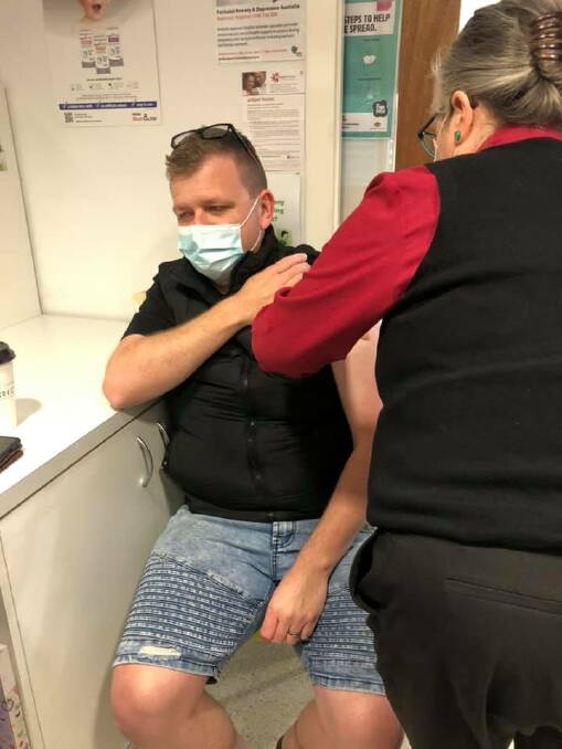 DOING HIS PART: Clint Ekert, 33, receives his AstraZeneca vaccine at Cessnock Plaza Pharmacy on August 17. Picture: Cessnock Pharmacies (Facebook)