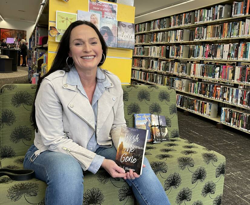 HUMBLED: Cessnock author DJ Blackmore with her fourth novel, 'Wish Me Gone', which will be released on September 7. Picture: Krystal Sellars