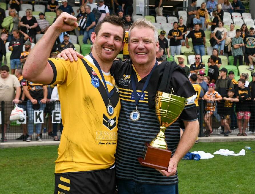 AGAINST THE ODDS: Cessnock Goannas captain Reed Hugo and coach Todd Edwards after last year's grand final victory. Picture: Smart Artist