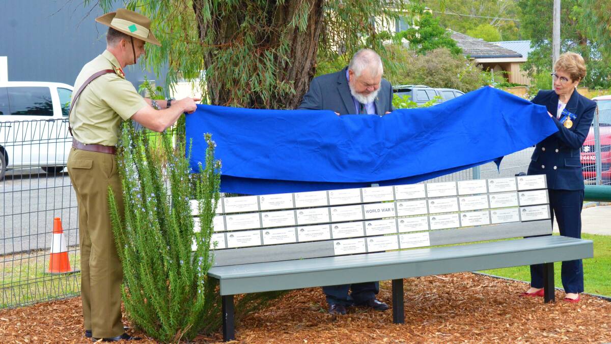UNVEILED: Brigadier Michael Garraway, Kearsley Dawn Service Committee secretary Dale Goldie and Governor of NSW, Margaret Beazley unveil one of the new World War II memorial benches at Kearsley Community Hall on Tuesday. Picture: Krystal Sellars