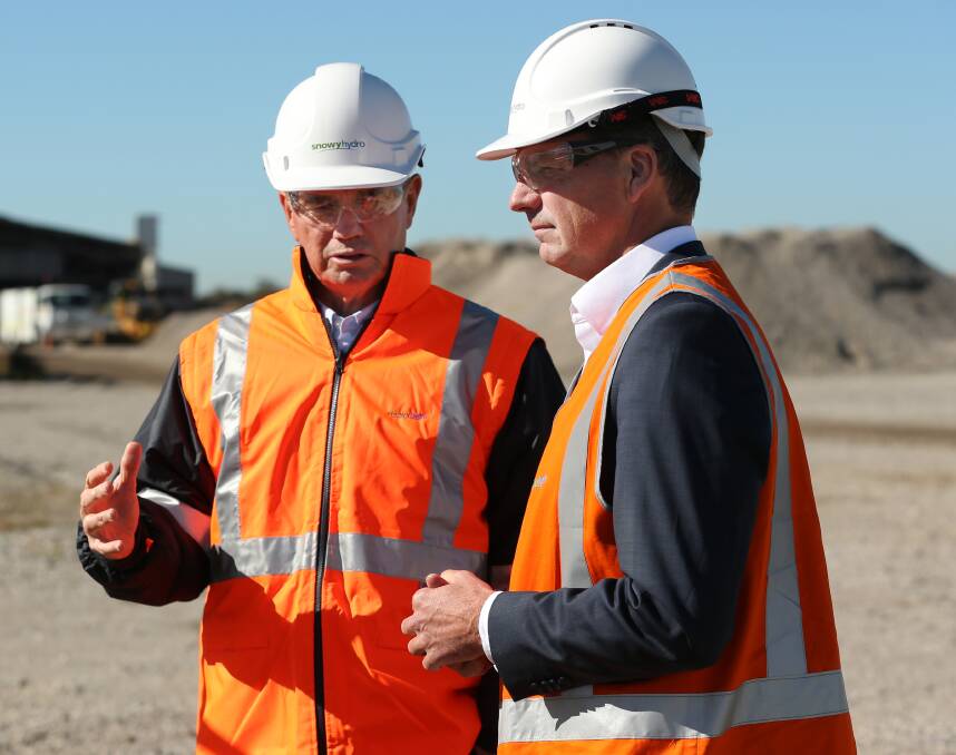 ON THE FRONT FOOT: Snowy Hydro CEO Paul Broad and federal energy minister Angus Taylor at the announcement of the Hunter Power Project in Kurri Kurri in May. Picture: Simone De Peak