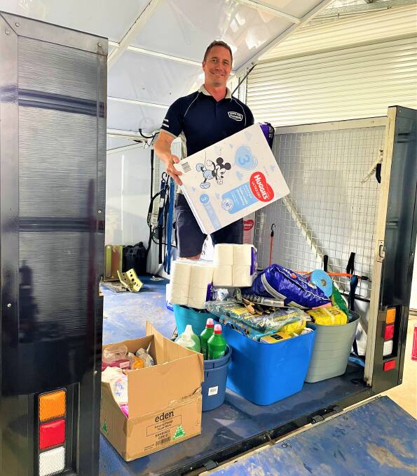 HELP IS ON THE WAY: Hunter Area Plumbing owner Dayne Poole with some of the items Cessnock residents have donated for the Mullumbimby community.