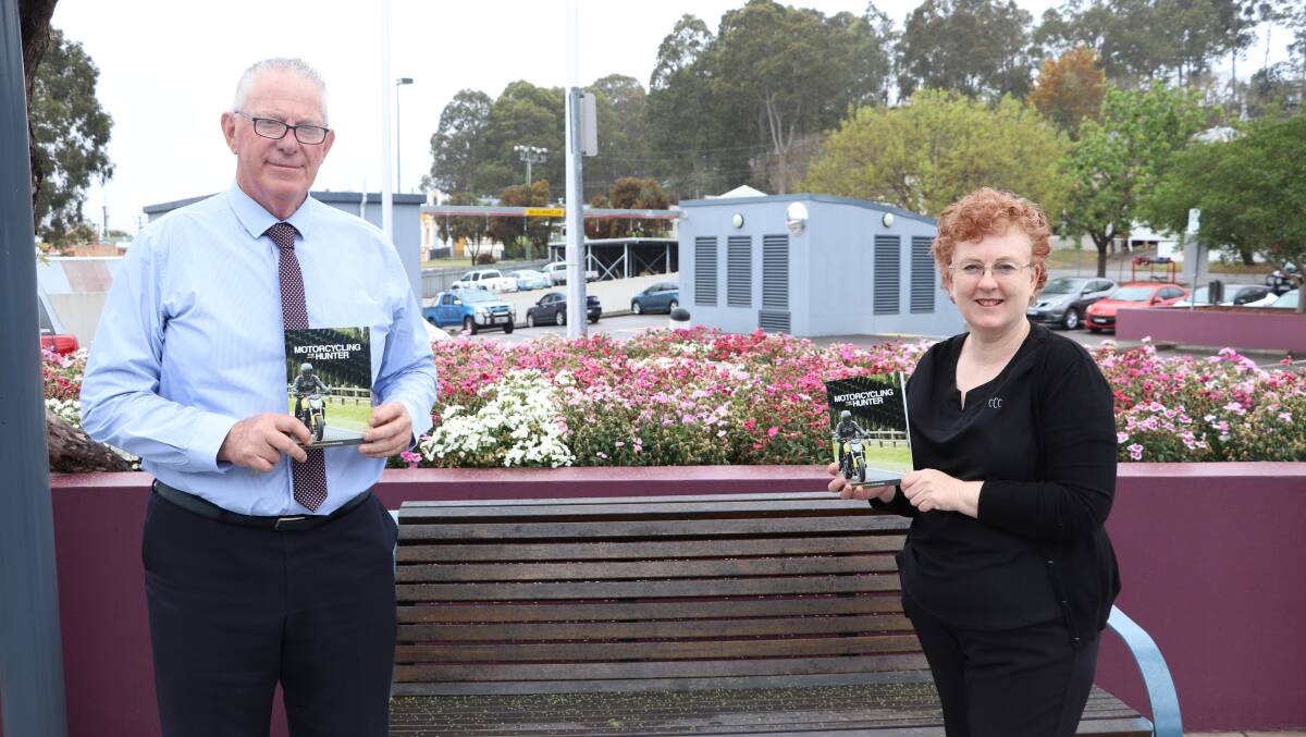 COMPREHENSIVE: Cessnock mayor Bob Pynsent and council's road safety officer Alison Shelton with a copy of the 2021 Motorcycling the Hunter publication.