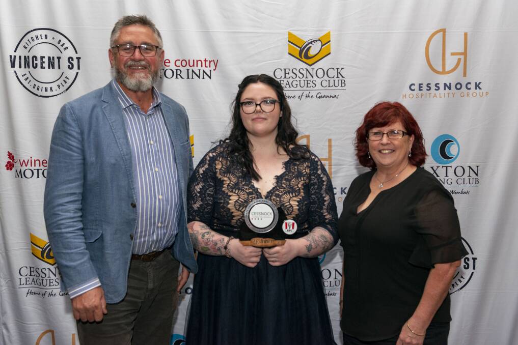 WINNER: Mackenzie Wilson (centre) with award sponsors Shayne Herring and Julie Kay from KFC Cessnock, at the 2021 Cessnock Customer Service Awards. Picture: Justin Worboys Photography