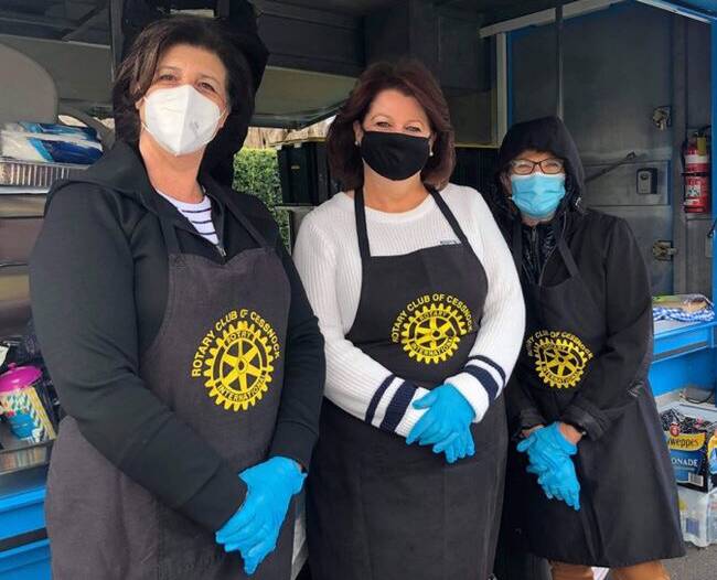 KIND: Friends of Rotary, Penny McNaughton, Liz Lamb and Wendy Harrop gave their time to help the Rotary Club of Cessnock prepare meals. Picture: George Koncz