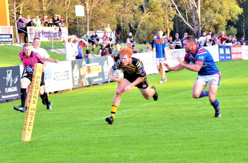 TRY TIME: Harvey Neville found himself popping up on the right wing to score the winner in the corner, beating Tyler Randall in a race to the line. Picture: Krystal Sellars 