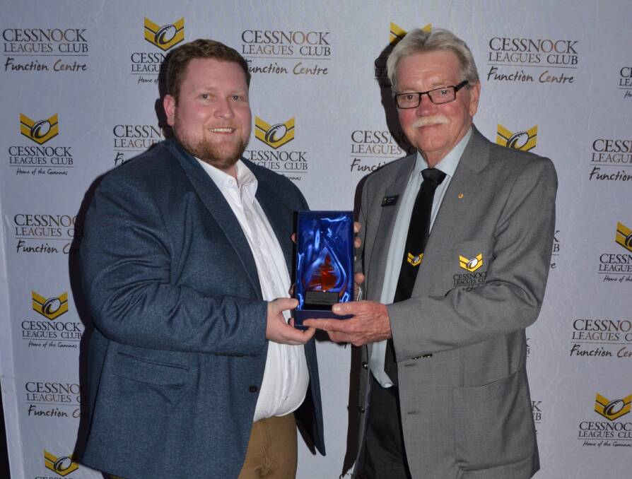 HONOUR: Kane Jackson from the Commonwealth Bank receives his trophy from Cessnock Leagues Club president Bruce Wilson at the 2019 Cessnock Customer Service Awards. Picture: Krystal Sellars