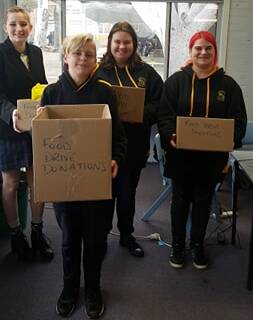 BUSY: Cessnock High Interact members Lily Giddings, Jennefer Wratten, Barry Nichol and Kadie Sondermeyer getting ready for the food donation drive. Picture: Jessica Gurnhill