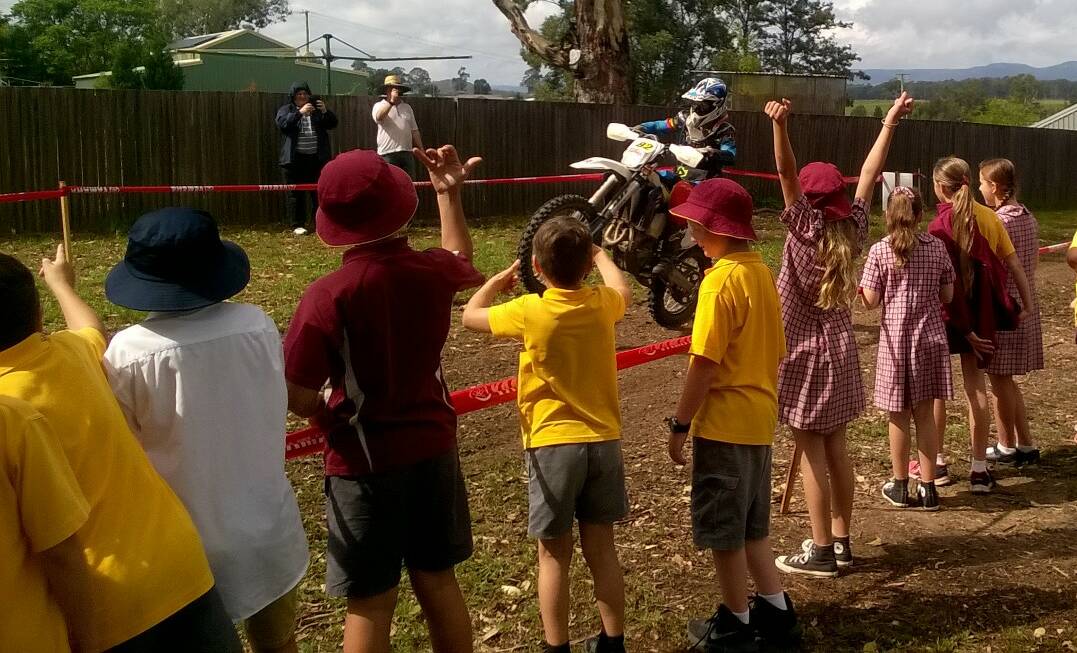 EXCITEMENT: Millfield Public School students cheer on a rider at the Australian Four-Day Enduro checkpoint at the school on April 6. Picture: supplied