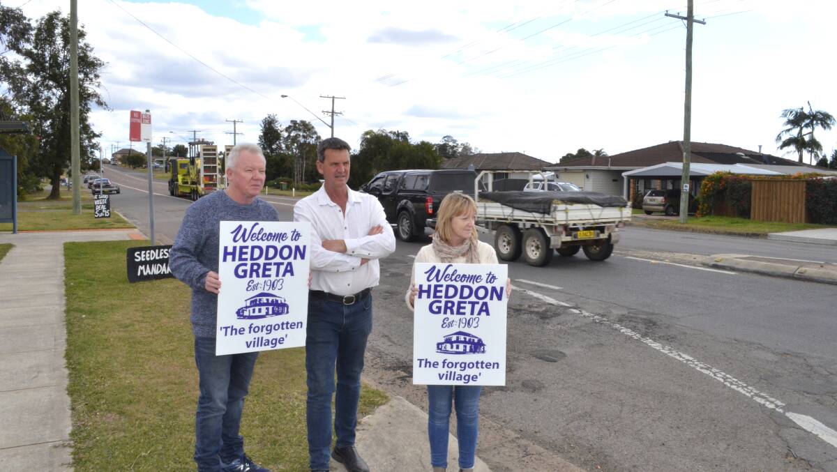 Pictured in August 2019, former Cessnock councillor Darrin Gray (centre) with Heddon Greta Residents Action Group members Steve Gilbey and Kim Newton on Main Road. Picture by Krystal Sellars.