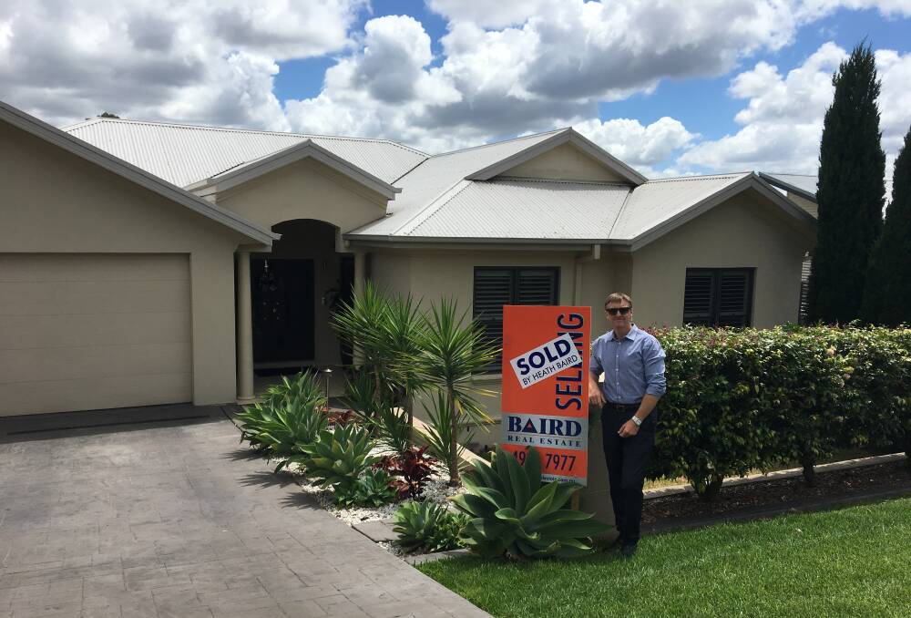 RECORD SALE: Heath Baird of Baird Real Estate at 4 Chapman Street, Cessnock, which sold for a record-breaking $700,000.