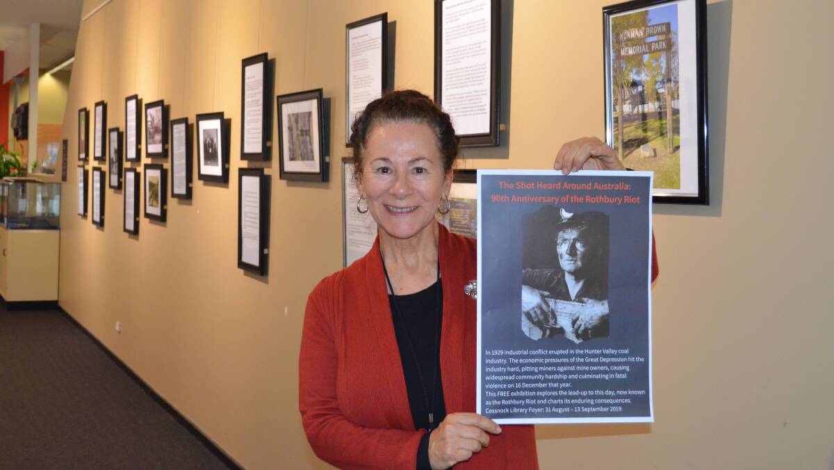 HISTORY: Cessnock City Library's local studies librarian Kimberly O'Sullivan in front of some of the items featured in the library's Rothbury Riot exhibition.
